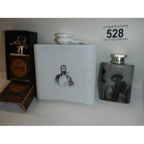 528 - 4 advertising hip flasks.