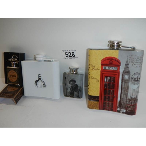 528 - 4 advertising hip flasks.