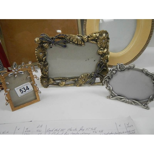 534 - 6 Interesting photograph frames including a 1920's example on ball feet.