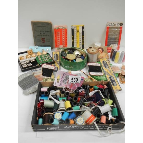 539 - A mixed lot of vintage reels of cotton, buttons etc.,