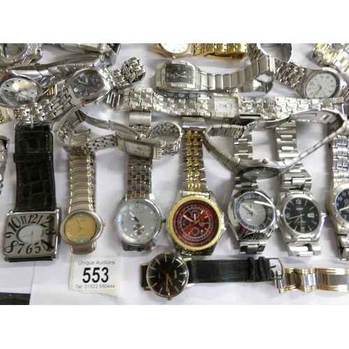 553 - Approximately 40 assorted gent's wristwatches.