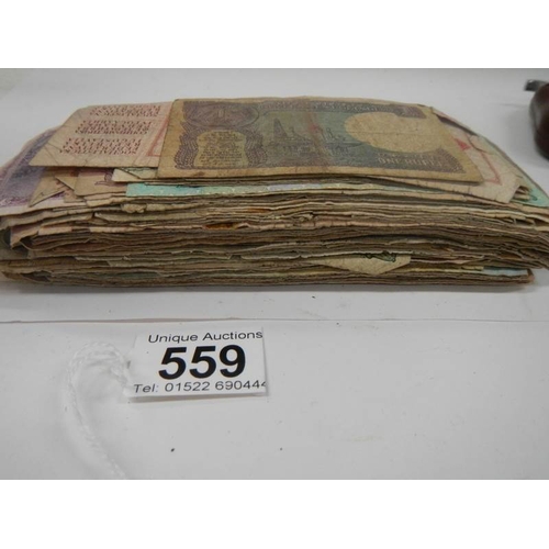 559 - Approximately 120 old bank notes (well used).