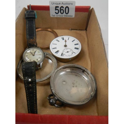 560 - An old silver watch (case needs work but in working order) and a ladies wrist watch.