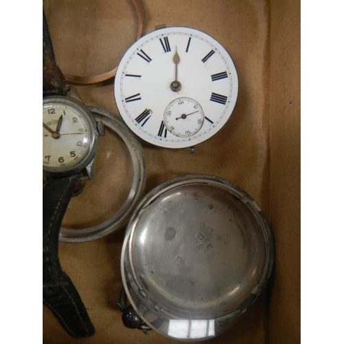 560 - An old silver watch (case needs work but in working order) and a ladies wrist watch.