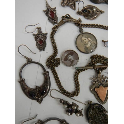 568 - A tray of jewellery including some silver, fob, earrings etc.