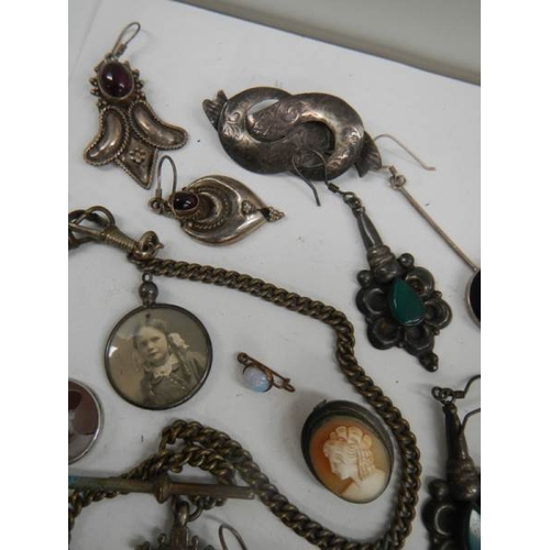 568 - A tray of jewellery including some silver, fob, earrings etc.