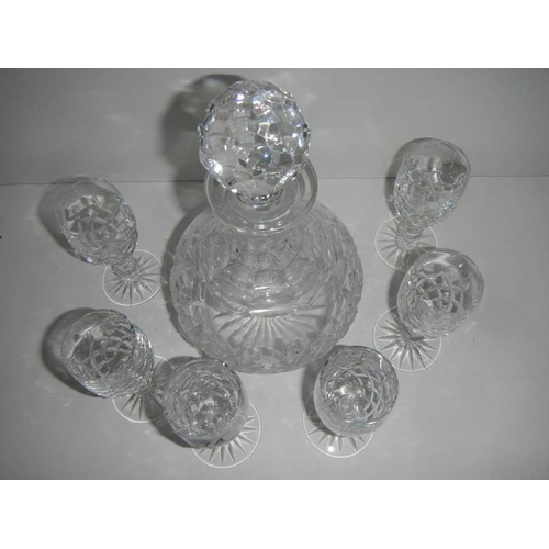 574 - A good quality cut glass decanter and 6 glasses, in good condition.