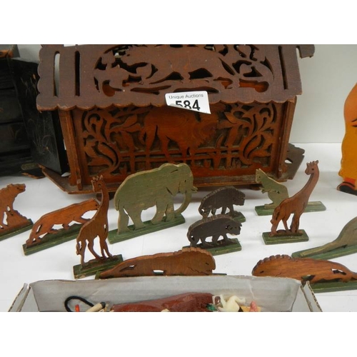 584 - An old toy Noah's ark with wooden animals, miniature chest etc.,