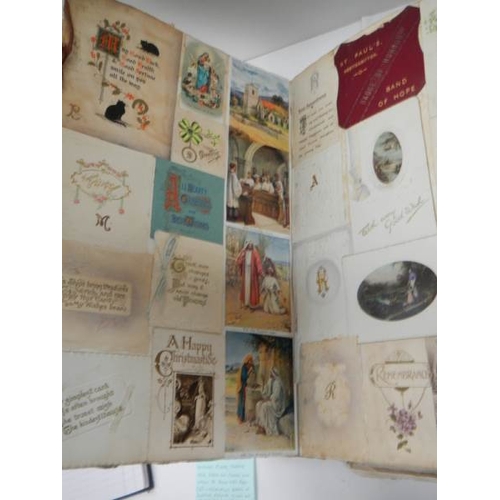 588 - A large and voluminous Victorian and Edwardian Album containing postcards,cigarette cards,scraps and... 