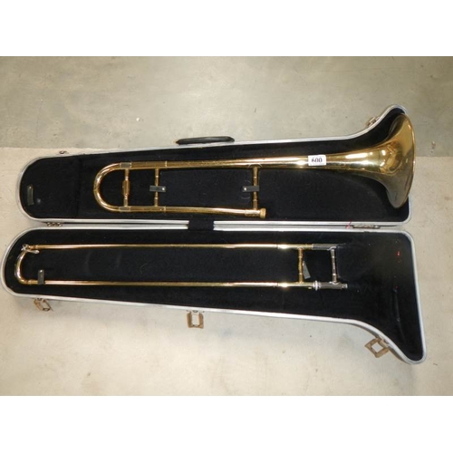 600 - A cased trombone by Blessing Scholastic, Made in U.S.A.