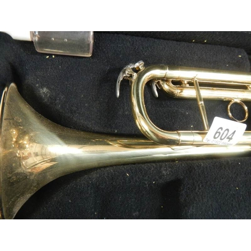 604 - An un-named brass trumpet in good working order and complete.