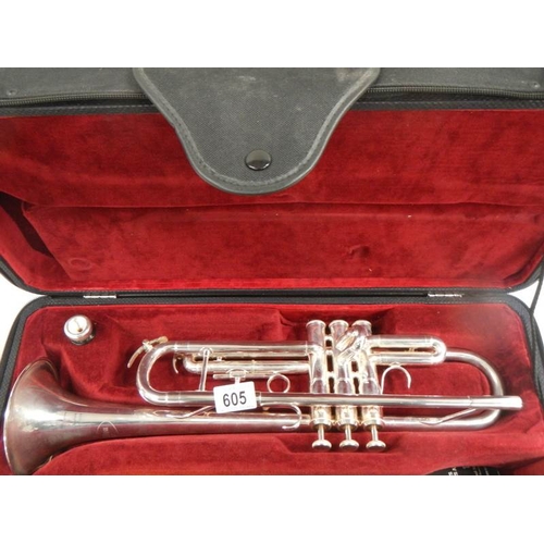 605 - A Besson 1000 silver plate trumpet complete with mouthpiece and in good condition.