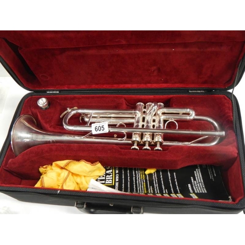 605 - A Besson 1000 silver plate trumpet complete with mouthpiece and in good condition.