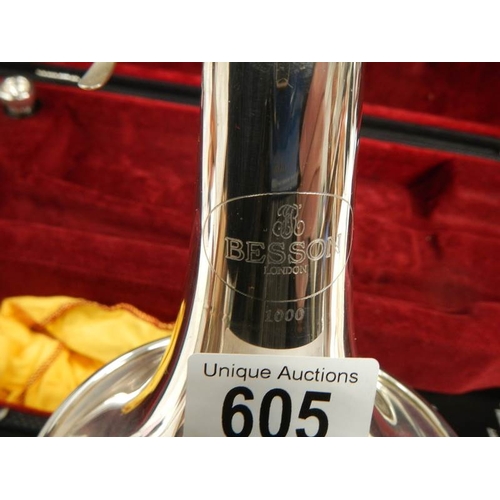 605 - A Besson 1000 silver plate trumpet complete with mouthpiece and in good condition.