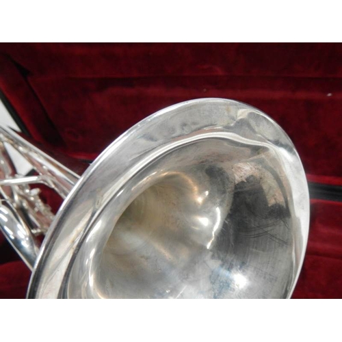 605 - A Besson 1000 silver plate trumpet complete with mouthpiece and in good condition.