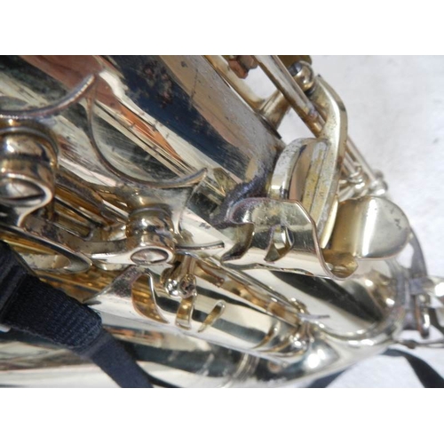 608 - A Thorn Trevor James & Co., alto saxaphone, lacquer worn but otherwise in good condition.