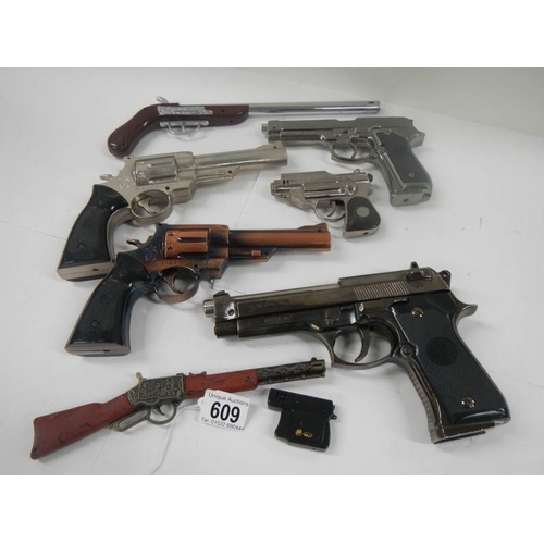 609 - A quantity of replica hand guns.