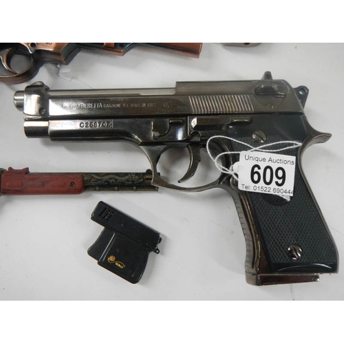 609 - A quantity of replica hand guns.