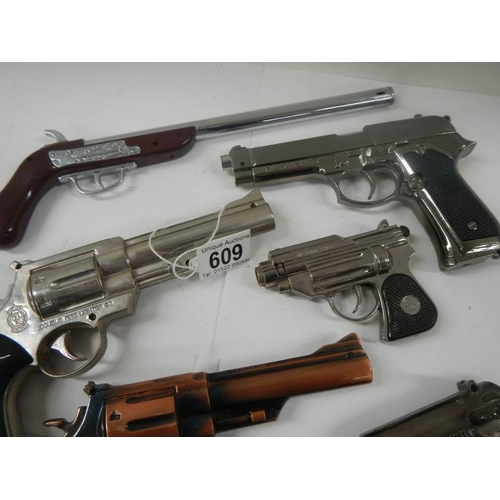 609 - A quantity of replica hand guns.