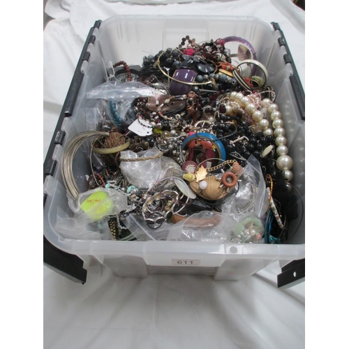 611 - A very large collection of unsorted costume jewellery, (crate not included)