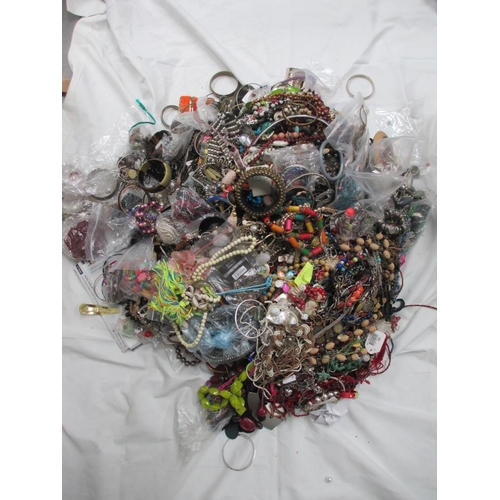 611 - A very large collection of unsorted costume jewellery, (crate not included)