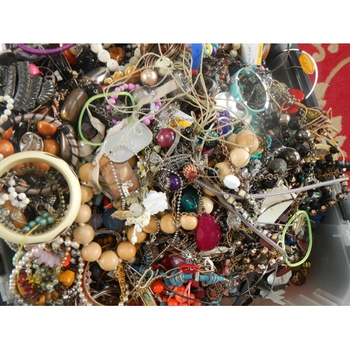 613 - A very large collection of unsorted costume jewellery,  (crate not included)