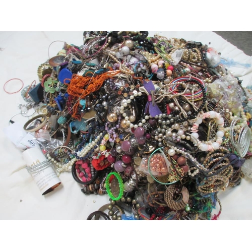 616 - A very large collection of unsorted costume jewellery. (crate not included)