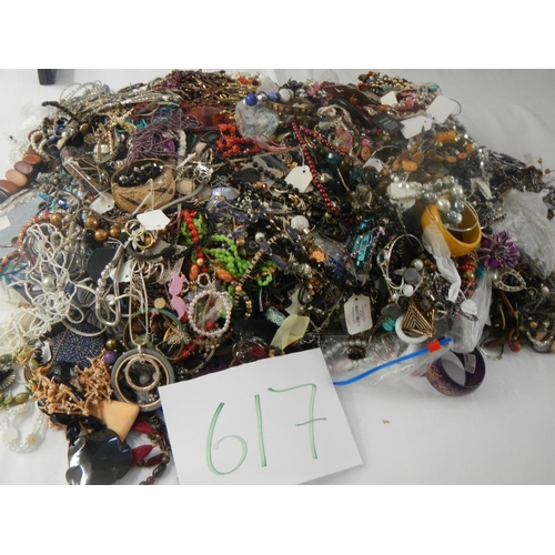 617 - A very large collection of unsorted costume jewellery. (crate not included)