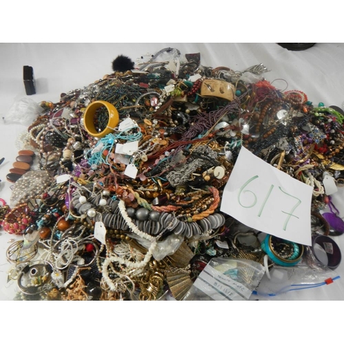 617 - A very large collection of unsorted costume jewellery. (crate not included)