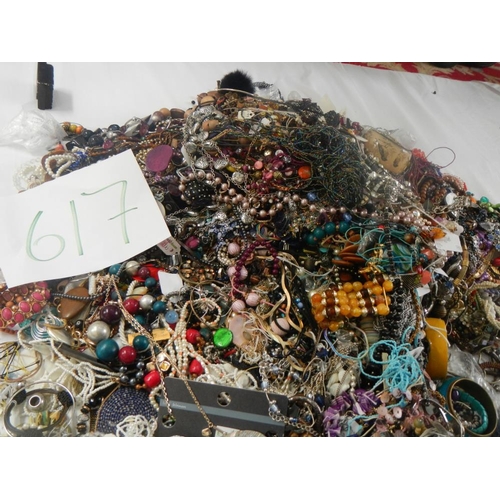 617 - A very large collection of unsorted costume jewellery. (crate not included)