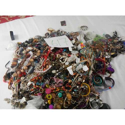 617 - A very large collection of unsorted costume jewellery. (crate not included)