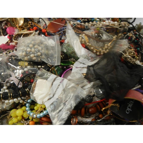 619 - A very large collection of unsorted costume jewellery. (crate not included)