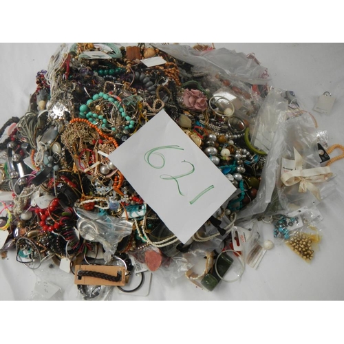 621 - A very large collection of unsorted costume jewellery. (crate not included).