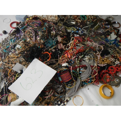 623 - A very large collection of unsorted costume jewellery.(crate not included)