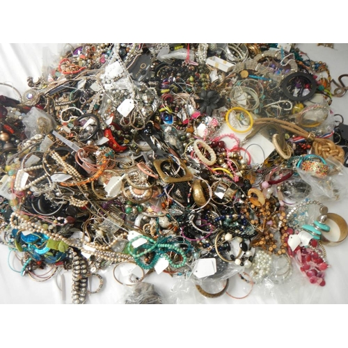 624 - A very large collection of unsorted costume jewellery (crate not included)