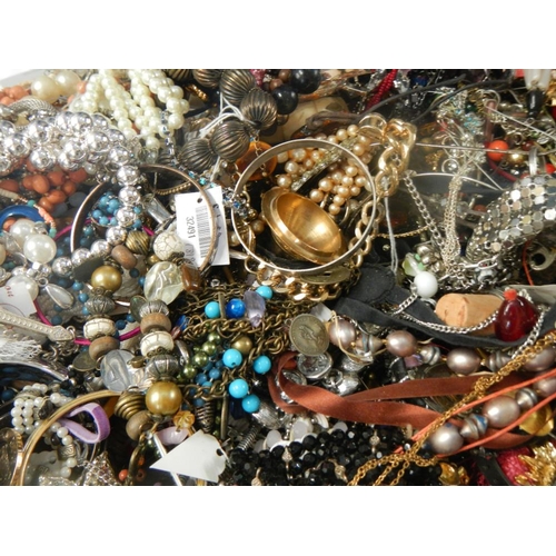 625 - A very large collection of unsorted costume jewellery (crate not included)