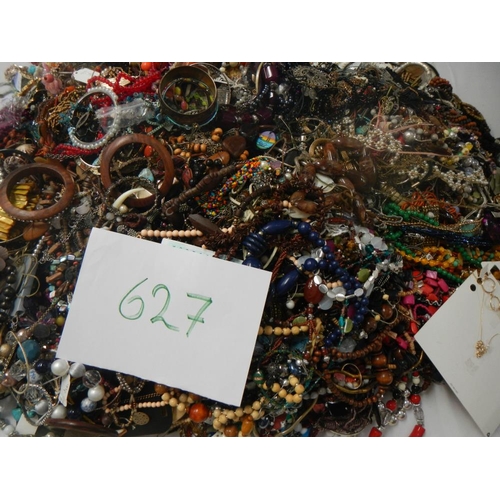 627 - A very large collection of unsorted costume jewellery (crate not included)