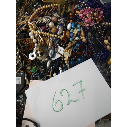 627 - A very large collection of unsorted costume jewellery (crate not included)