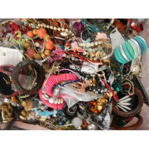 627 - A very large collection of unsorted costume jewellery (crate not included)