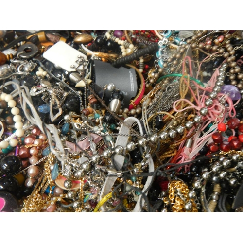 628 - A very large collection of unsorted costume jewellery (crate not included)