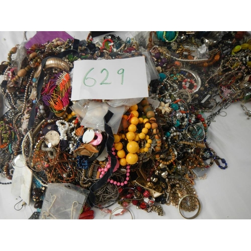 629 - A very large collection of unsorted costume jewellery (crate not included)