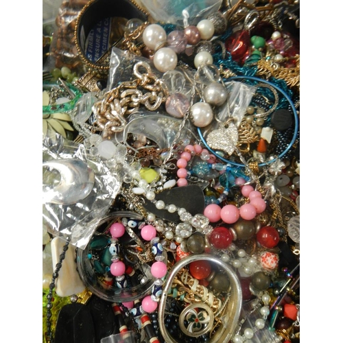 629 - A very large collection of unsorted costume jewellery (crate not included)