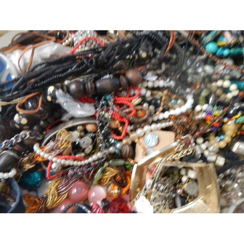 629 - A very large collection of unsorted costume jewellery (crate not included)