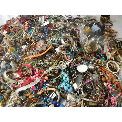 630 - A very large collection of unsorted costume jewellery (crate not included)