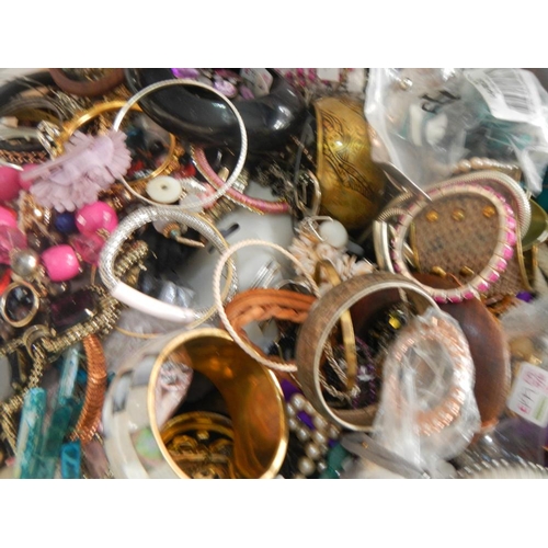 630 - A very large collection of unsorted costume jewellery (crate not included)