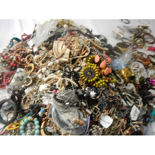 630 - A very large collection of unsorted costume jewellery (crate not included)