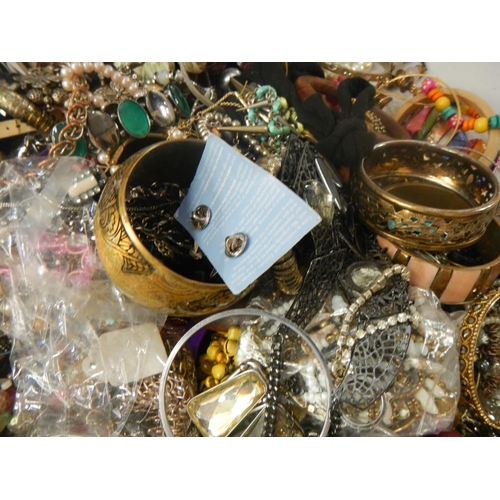 630 - A very large collection of unsorted costume jewellery (crate not included)