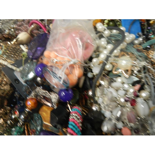 631 - A very large collection of unsorted costume jewellery  (crate not included)