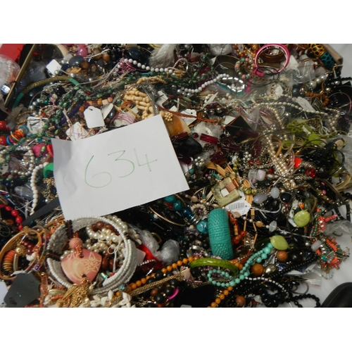 634 - A very large collection of unsorted costume jewellery  (crate not included)