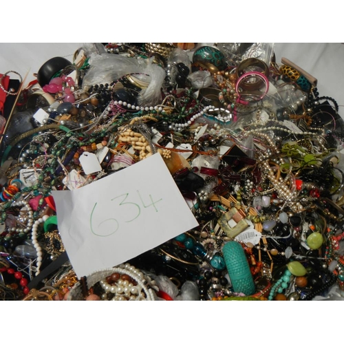 634 - A very large collection of unsorted costume jewellery  (crate not included)